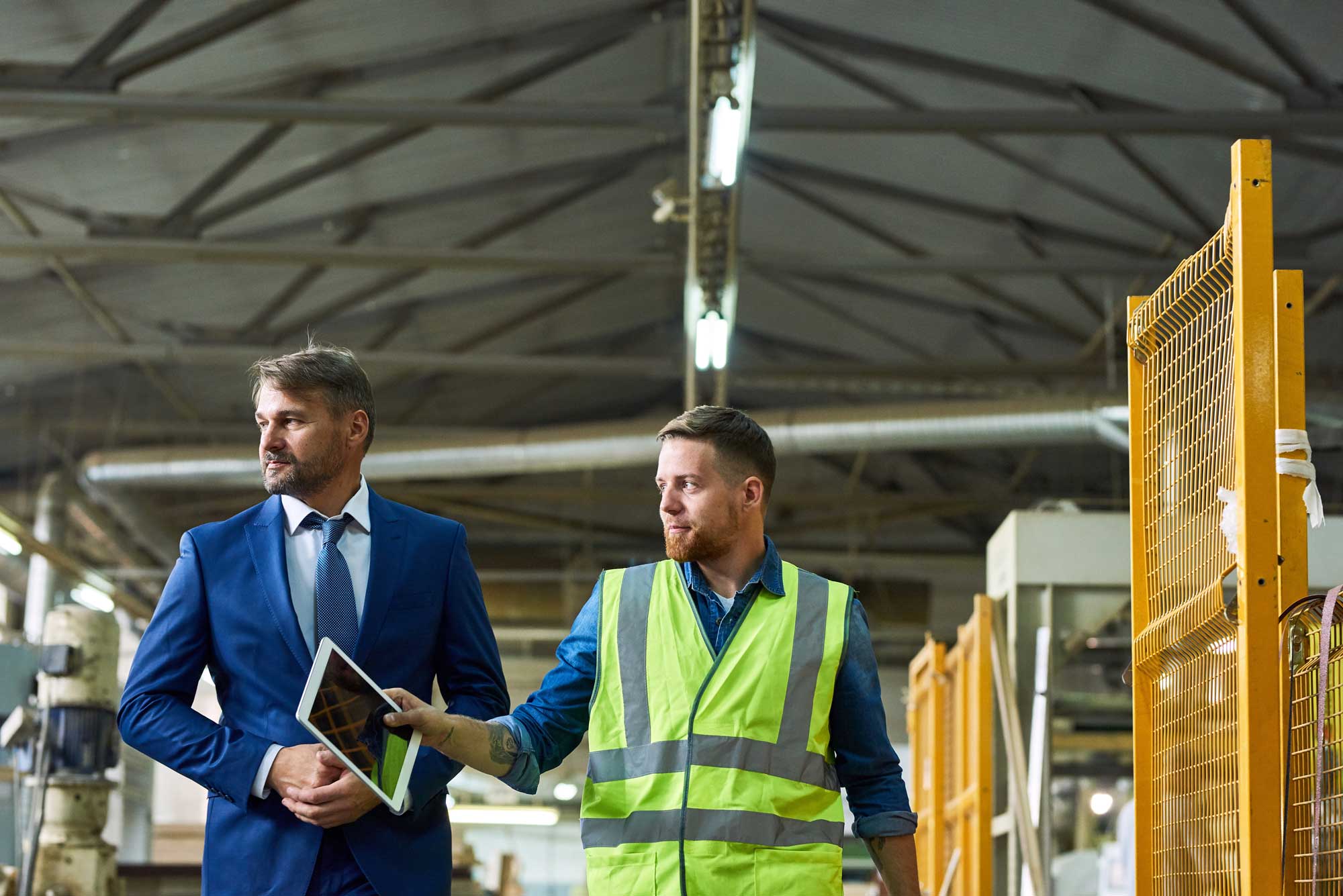 business owner and worker in factory